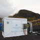 Direct air capture unit along with the cooling towers of the geothermal power plant in Hellisheidi, Iceland.
